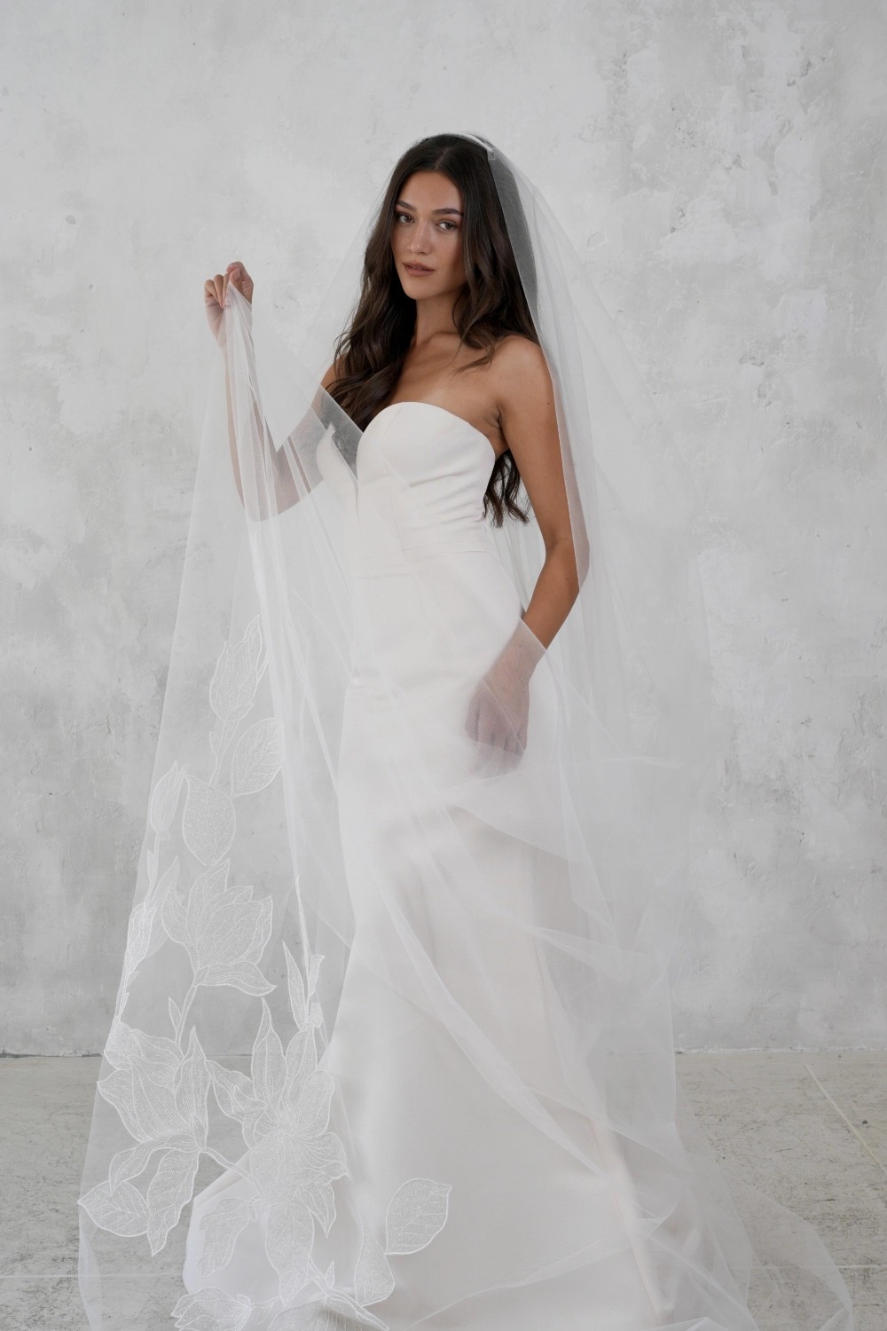 Models wearing a white dress