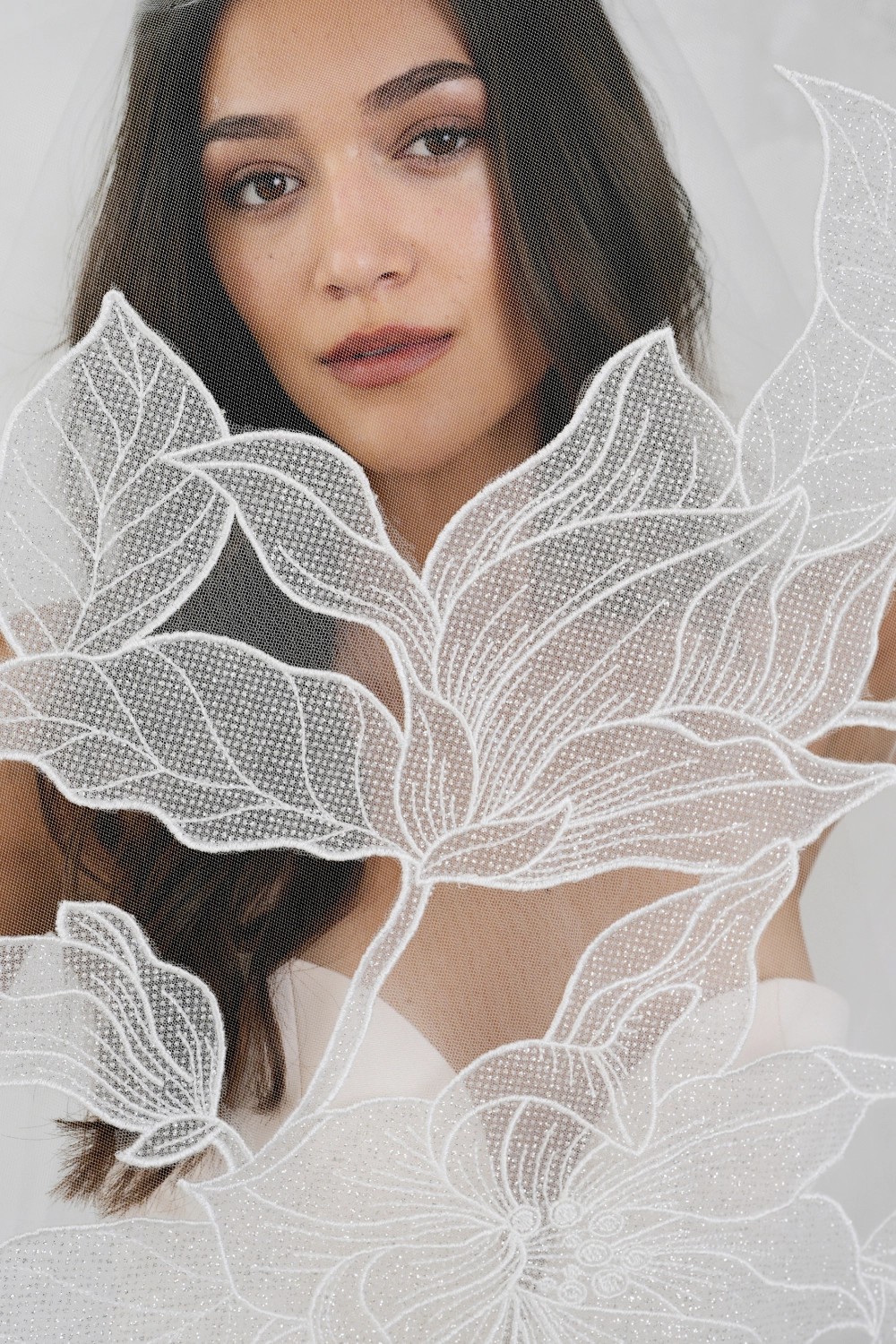 Model wearing a white dress. Photo 1